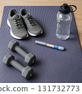 Wellness workout concept with yoga mat dumbbells 131732773