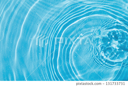 drops on water with circles on a blue background 131733731