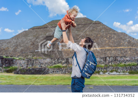 Father with his little toddler son as tourists in front of the pyramids of Teotihuacan in Mexico, enjoying sightseeing, family bonding, and cultural heritage 131734352
