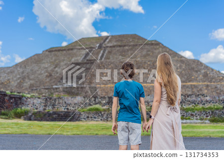 Mother and her son as tourists in front of Teotihuacan pyramids, Mexico, enjoying sightseeing, family travel, and cultural exploration together Mother and her son as tourists in front of Teotihuacan pyramids, Mexico, enjoying sightseeing, family travel, and cultural exploration together 131734353