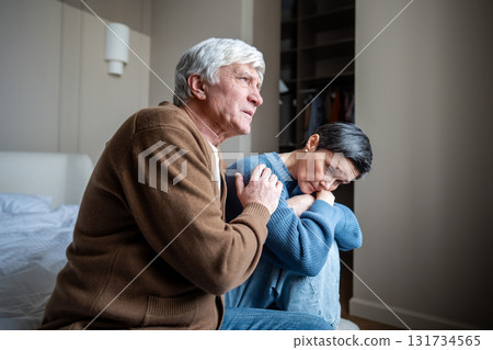 Elderly couple in grief and depression, man husband comforting woman with mental health struggles 131734565
