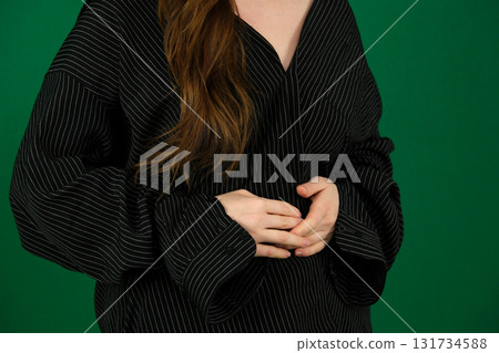 Set of videos featuring female hands of young European woman making different gestures on green chroma key background showing folded hands open palms and clenched fingers with copy space Set of videos featuring female hands of young European woman making different gestures on green chroma key background showing folded hands open palms and clenched fingers with copy space 131734588