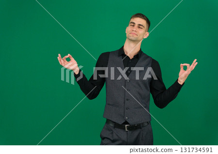 Set of videos with handsome European businessman in classic suit vest and black shirt showing different emotions gestures and confident poses on green chroma key background with copy space 131734591