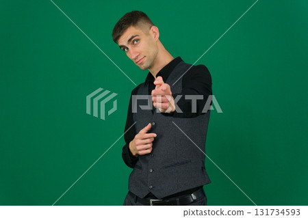 Set of videos with handsome European businessman in classic suit vest and black shirt showing different emotions gestures and confident poses on green chroma key background with copy space 131734593