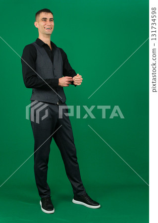 Set of videos with handsome European businessman in classic suit vest and black shirt showing different emotions gestures and confident poses on green chroma key background with copy space 131734598