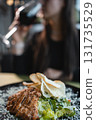 woman drink wine or eat caesar salad with grilled chicken, romaine and crouton 131735529