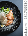 top view of caesar salad with chicken, romaine and egg on black background 131735530
