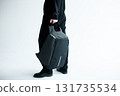 stylish hipster person holding modern backpack bag on white background 131735534