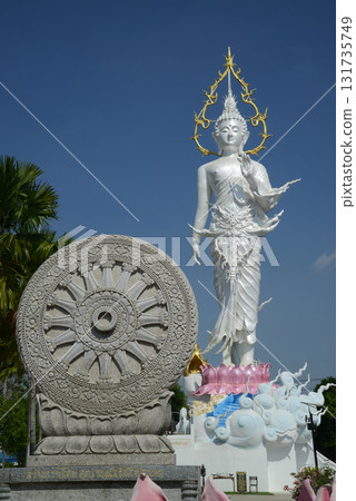 Phra Phutthaphon Sri Asvamuni, a 28-meter-high standing Buddha statue bestowing blessings and the Wheel of Dhamma at Wat Nong Jab Tao. Phra Phutthaphon Sri Asvamuni, a 28-meter-high standing Buddha statue bestowing blessings and the Wheel of Dhamma at Wat Nong Jab Tao. 131735749