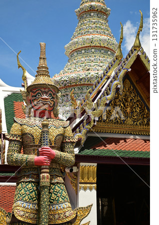 The large giant guardian standing guard at Wat Phra Kaew Temple of the Emerald Buddha is a famous tourist attraction. Bangkok capital city in Thailand. 131735962