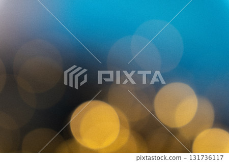 Blue and golden bokeh light leak overlay effect, dreamy blurred glowing circles with vintage film grain texture, festive abstract background Blue and golden bokeh light leak overlay effect, dreamy blurred glowing circles with vintage film grain texture, festive abstract background 131736117