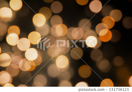Golden bokeh light overlay effect on dark background, festive blurred glowing circles for holiday design Golden bokeh light overlay effect on dark background, festive blurred glowing circles for holiday design 131736123