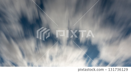 Dramatic moving clouds in night sky 131736129