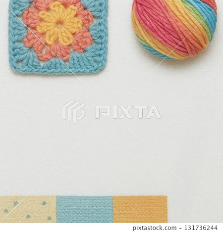 Colorful yarn ball and crocheted granny square on white background 131736244