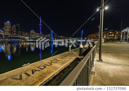 Night view of the Sky Tower and Yacht Harbour from the Viaduct in Auckland, New Zealand 131737098