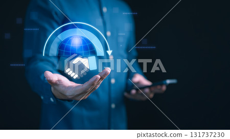 Businessman holding digital of globe and handshake with circular arrow. Concept of global business partnership, online collaboration, international trade, networking, digital deal and teamwork. Businessman holding digital of globe and handshake with circular arrow. Concept of global business partnership, online collaboration, international trade, networking, digital deal and teamwork. 131737230