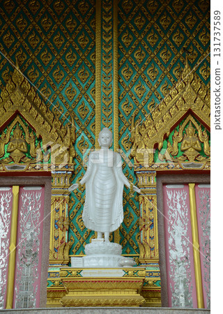 Standing white Buddha statue front of Thai Buddhist Church is enshrined at Wat Nong Yai. Standing white Buddha statue front of Thai Buddhist Church is enshrined at Wat Nong Yai. 131737589