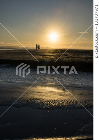 Piha Beach illuminated by the setting sun near Auckland, New Zealand Piha Beach illuminated by the setting sun near Auckland, New Zealand 131737971