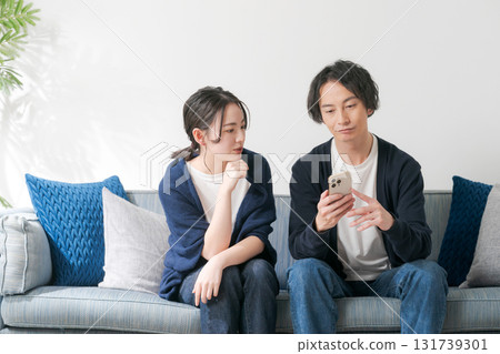 Men and women worried about looking at smartphones 131739301