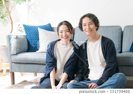 Young men and women relaxing at home 131739408