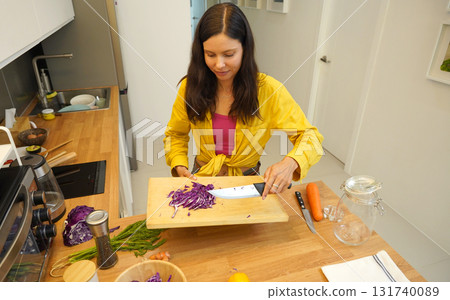 Young woman is broadcasting live from workshop how to prepare a vegetarian food Young woman is broadcasting live from workshop how to prepare a vegetarian food 131740089