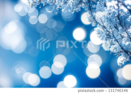 Winter white flowers, blue sky and light bokeh background_Fantastic winter scenery material 131740146