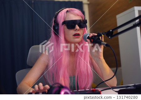 Beautiful young singer and musician broadcast from her home studio 131740280