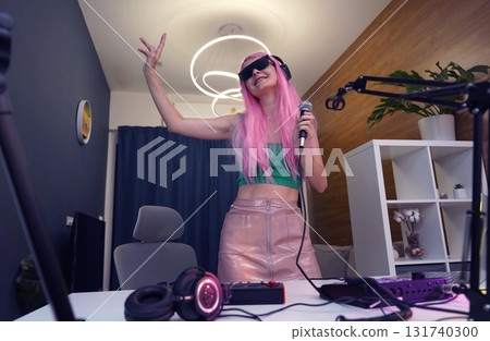 Beautiful young singer and musician broadcast from her home studio Beautiful young singer and musician broadcast from her home studio 131740300