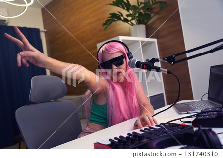 Beautiful young singer and musician broadcast from her home studio 131740310