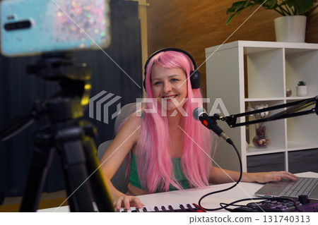 Beautiful young singer and musician broadcast from her home studio 131740313