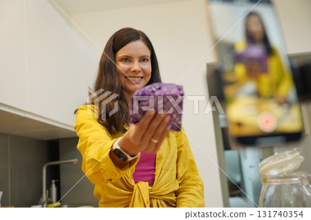 Young woman is broadcasting live from workshop how to prepare a vegetarian food 131740354