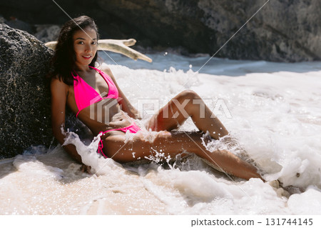 Beauty woman in bikini at tropical beach. Pretty lady in ocean 131744145
