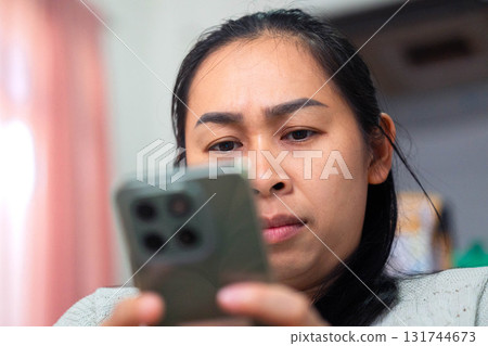 Asian Woman Feeling Eye Strain from Using Smartphone Asian Woman Feeling Eye Strain from Using Smartphone 131744673