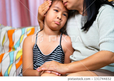 Asian Mother Comforting Her Sad Daughter at Home 131744832
