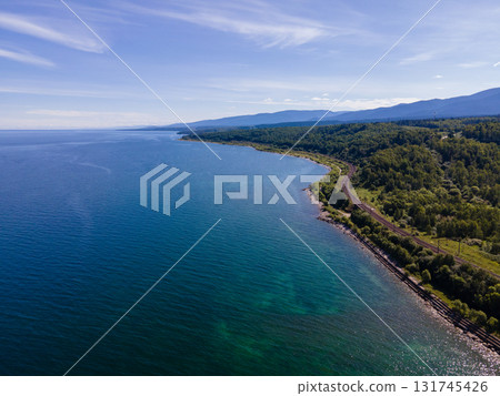 Scenic view of the coastline of Baikal lake, Russia with lush greenery Scenic view of the coastline of Baikal lake, Russia with lush greenery 131745426