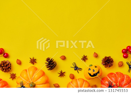 Halloween decorations over a yellow background Halloween decorations over a yellow background 131745553