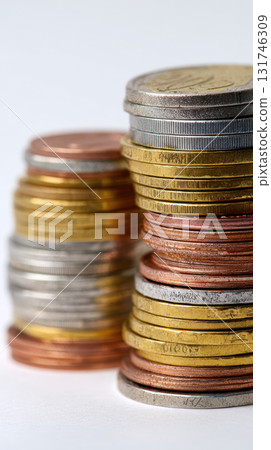 Stacked coins, colorful metal currency, close up, isolated, simple background, financial concept Stacked coins, colorful metal currency, close up, isolated, simple background, financial concept 131746309