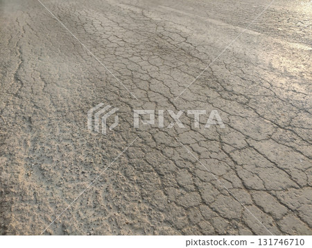 Cracks on asphalt road surface showing damage and broken infrastructure Cracks on asphalt road surface showing damage and broken infrastructure 131746710