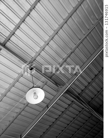Industrial Metal Ceiling with Hanging White Light Fixture Industrial Metal Ceiling with Hanging White Light Fixture 131746915
