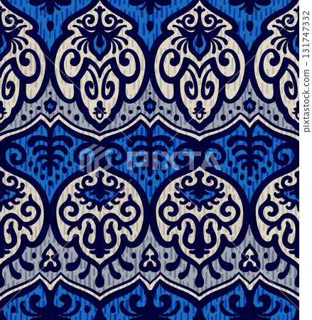 Seamless ikat inspired ornamental pattern with traditional ethnic floral motifs in rich blue tones 131747332