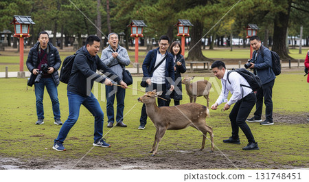 Asian man assaulting deer in Nara Park 131748451