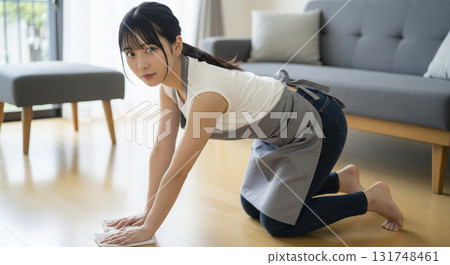 A woman cleaning on all fours A woman cleaning on all fours 131748461