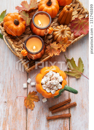 Cozy autumn arrangement with hot chocolate and candles Cozy autumn arrangement with hot chocolate and candles 131748899