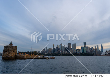 Sydney skyline at sunset with golden reflections on the water Sydney skyline at sunset with golden reflections on the water 131749298
