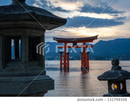 Torii of Itsukushima Shrine at sunset on Miyajima island Torii of Itsukushima Shrine at sunset on Miyajima island 131749308