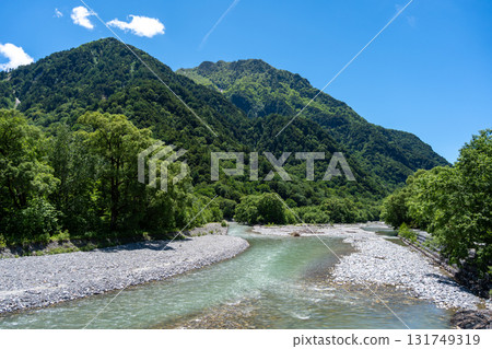 Azusa River and mountain view along Kamikochi trail, Japan Azusa River and mountain view along Kamikochi trail, Japan 131749319