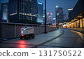 Autonomous delivery robot with glowing light moves along quiet city street at night. futuristic vision of automated urban logistics 131750522