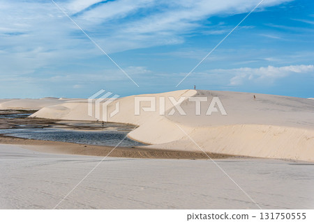 Dunes and lagoons of lagoa bonita, Lencois Maranhenses, Barreirinhas, Brazil. White sand dunes with pools of fresh water Dunes and lagoons of lagoa bonita, Lencois Maranhenses, Barreirinhas, Brazil. White sand dunes with pools of fresh water 131750555