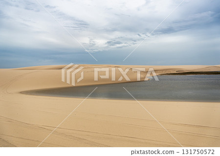 Dunes and lagoons of Atins, Lencois Maranhenses, Barreirinhas, Brazil. White sand dunes with pools of fresh water Dunes and lagoons of Atins, Lencois Maranhenses, Barreirinhas, Brazil. White sand dunes with pools of fresh water 131750572