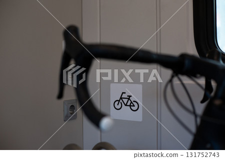 Sign indicating bicycle parking in public transport vehicle, promoting eco friendly travel and urban mobility, offering convenient space for cyclists in modern transportation systems Sign indicating bicycle parking in public transport vehicle, promoting eco friendly travel and urban mobility, offering convenient space for cyclists in modern transportation systems 131752743
